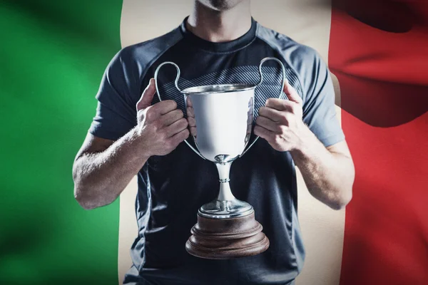 Rugby player holding trophy — Stock Photo, Image