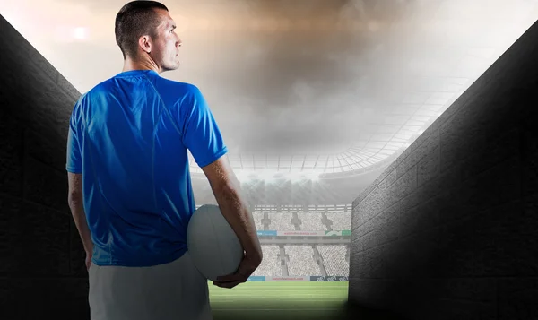 Player looking away while holding ball — Stock Photo, Image