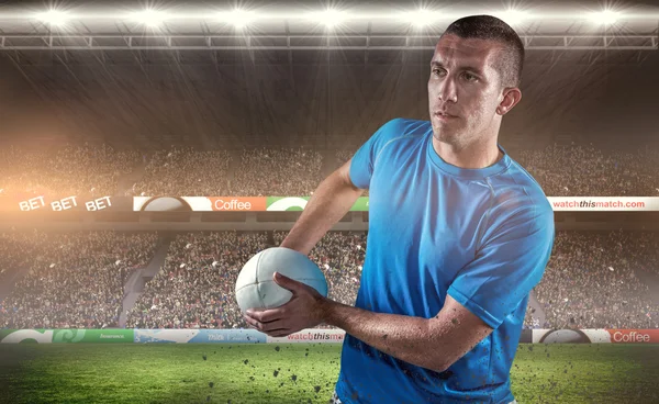 Player looking away while holding ball — Stock Photo, Image