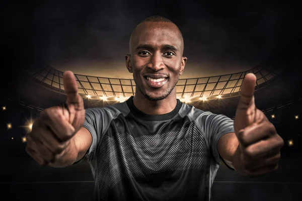 Athlete smiling and showing thumbs up — Stock Photo, Image