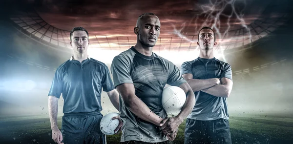 Jogadores segurando um rugby bolas — Fotografia de Stock