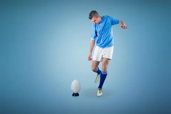 Jogador fazendo um chute de gota — Fotografia de Stock