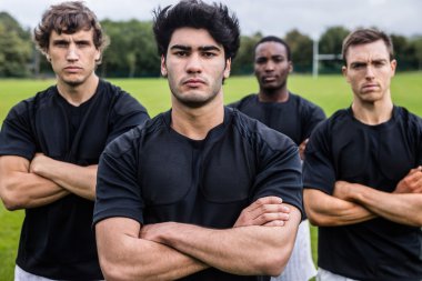 Rugby players scowling at camera clipart