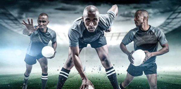 Rugbyspillere med baller som løper – stockfoto