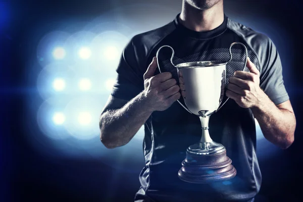 Rugby player holding kupa — Stok fotoğraf