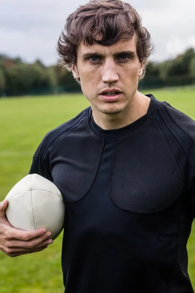 Rugby player scowling at camera — Stock Photo, Image