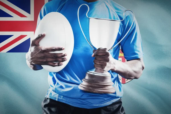 Sportsman holding trophy — Stock Photo, Image