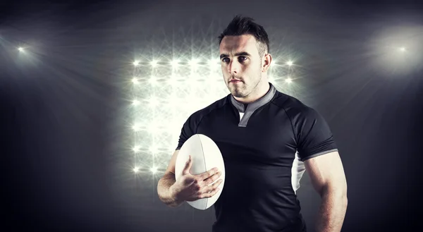 Rugby player holding ball — Stock Photo, Image