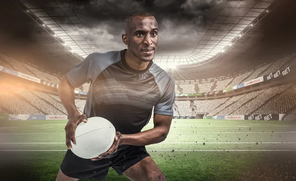 Jugador en posición de lanzar la pelota — Foto de Stock