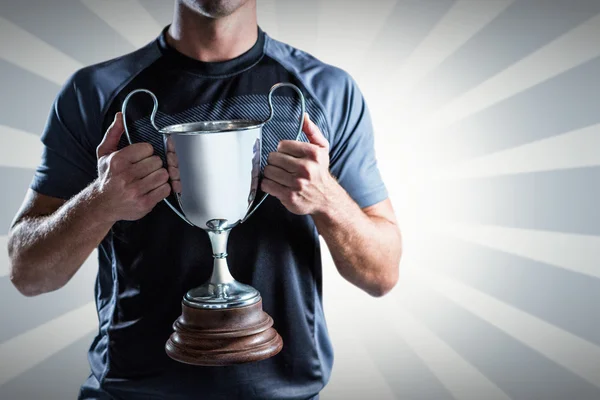 Jogador ugby segurando troféu — Fotografia de Stock