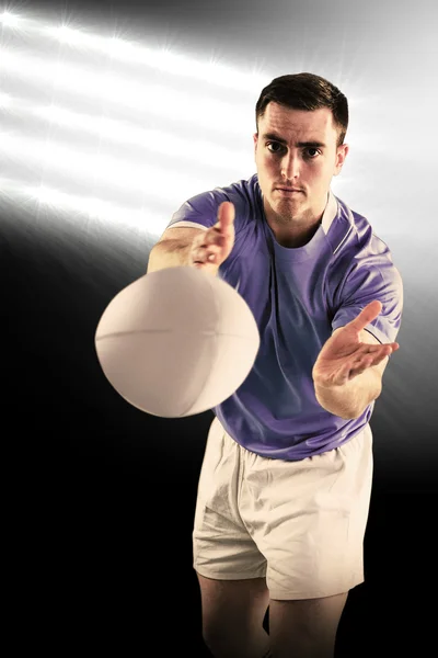 Rugby player catching a rugby ball — Stock Photo, Image