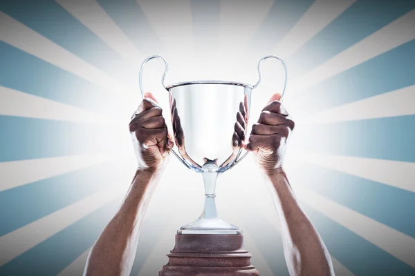 Hands of athlete holding trophy — Stock Photo, Image