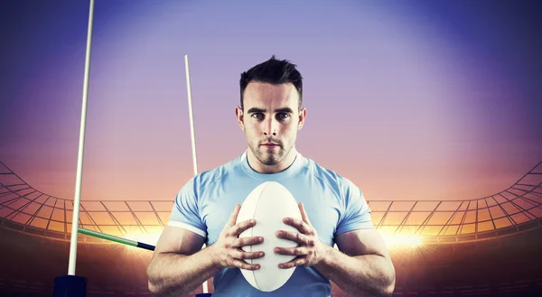 Player looking at camera with ball — Stock Photo, Image