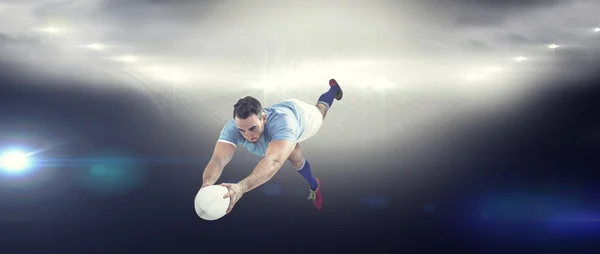 Jogador de rugby marcando uma tentativa — Fotografia de Stock