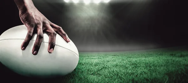 Sportsman holding rugby ball — Stock Photo, Image