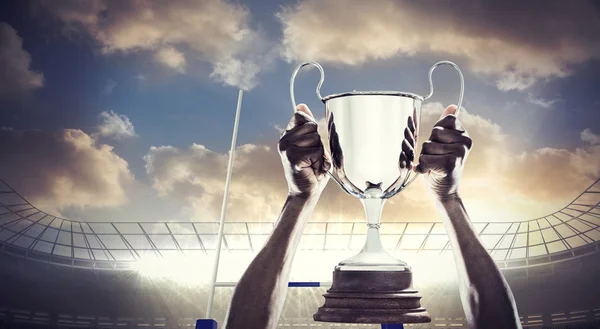 Athlete holding trophy — Stock Photo, Image