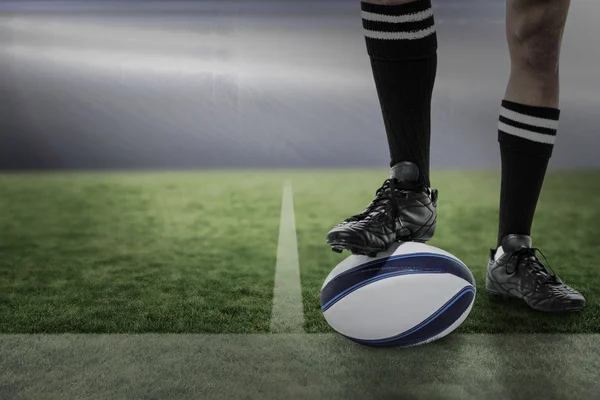 Player in black socks on ball — Stock Photo, Image