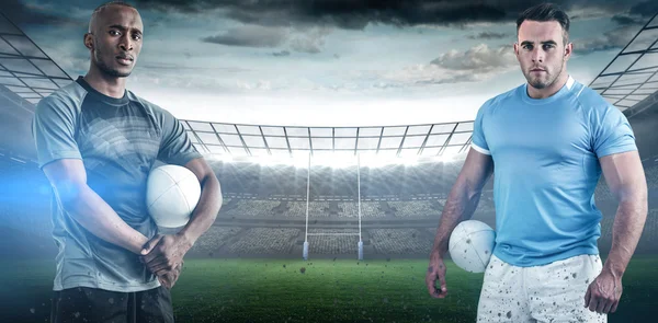 Säker idrottsmän med rugby bollar — Stockfoto