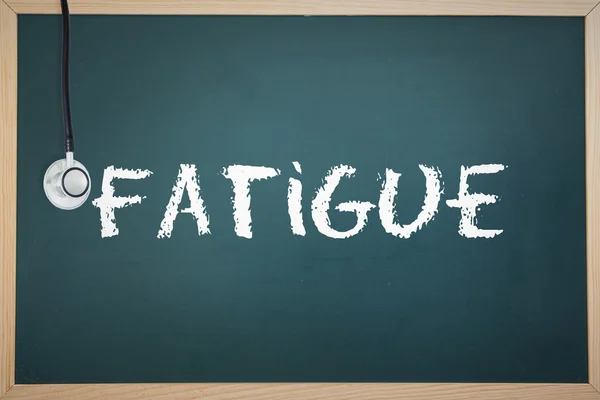 The word fatigue and stethoscope — Stock Photo, Image