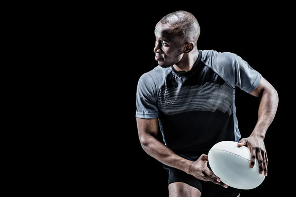 Atleta corriendo con pelota de rugby — Foto de Stock