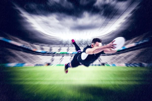 Jogador de rugby marcando uma tentativa — Fotografia de Stock