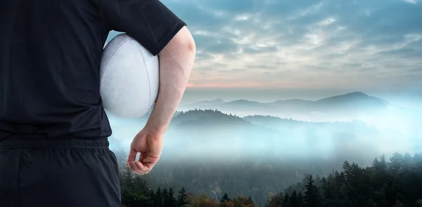 Rugby player holding a rugby ball — Stock Photo, Image