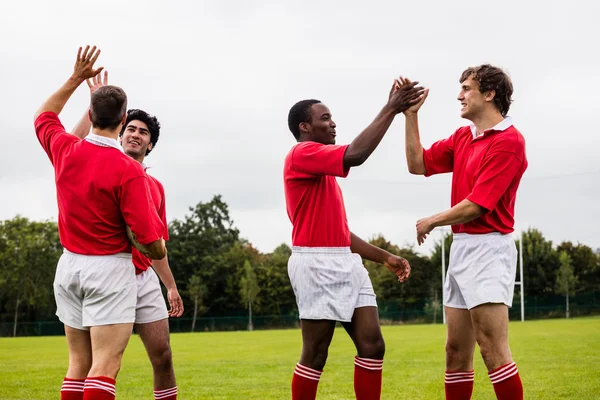 Rugby players celebrating a win — Stock Photo, Image