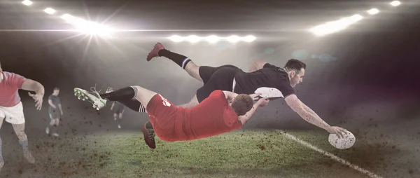 Jogador de rugby marcando uma tentativa — Fotografia de Stock