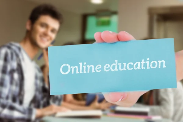 Word online education and hand showing card — Stock Photo, Image