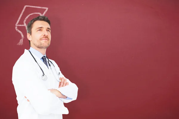 Stilig ung läkare med armarna korsade — Stockfoto