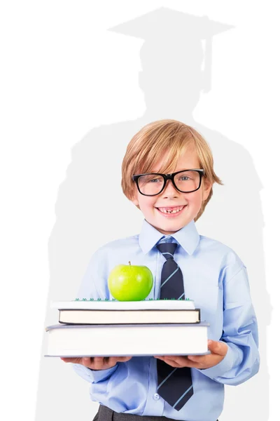 Cute pupil holding books and apple — Stock Photo, Image