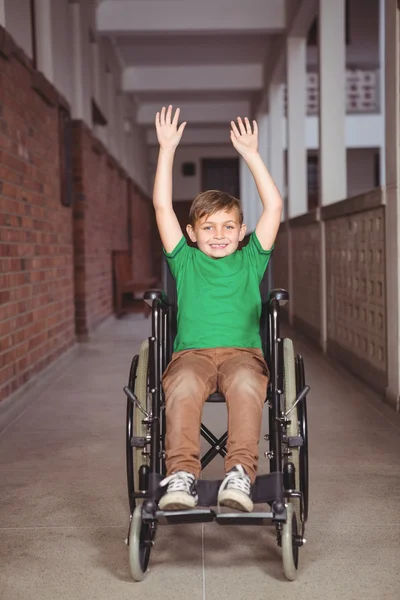 Smiling student in wheelchair with arms raised — Stock Photo, Image