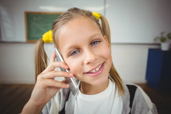 Pupil phoning with smartphone in classroom — Stock Photo, Image