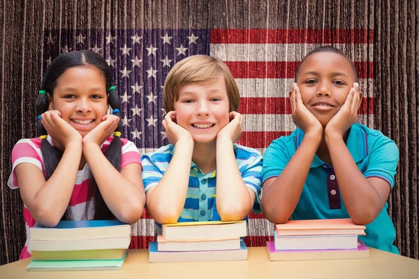 Pupils looking at camera in library — Stock Photo, Image