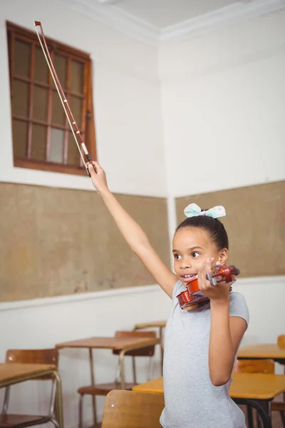 Student using a violin in class — Stock Photo, Image