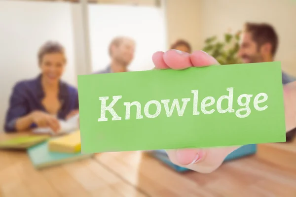 Knowledge against group of colleagues reading books — Stock Photo, Image