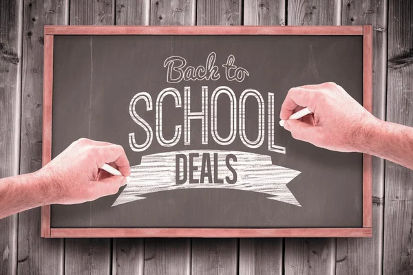 Composite image of hands writing with chalk — Stock Photo, Image