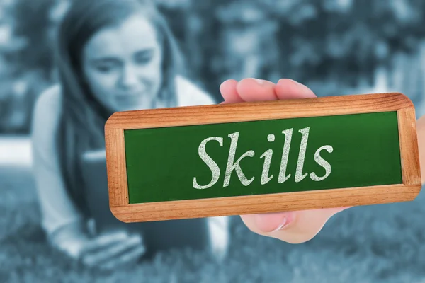 Word skills and hand showing chalkboard — Stock Photo, Image