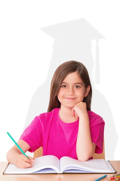 Cute pupil working at her desk — Stock Photo, Image