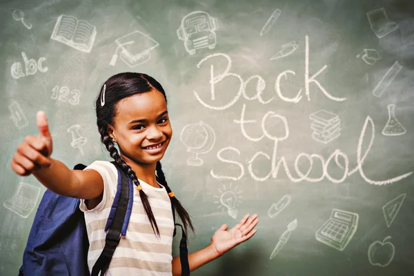 Little girl gesturing thumbs up — Stock Photo, Image