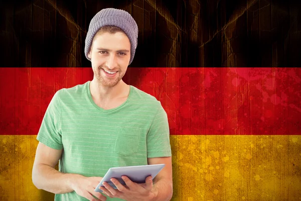 Estudante usando tablet contra bandeira da alemanha — Fotografia de Stock