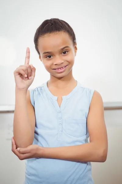 Pupil raising hand to blackboard — Stock Photo, Image