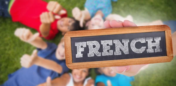 Word Franse en hand tonen schoolbord — Stockfoto