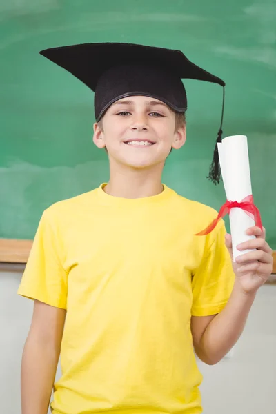 Smiling pupil with mortar board and diploma — Stock Photo, Image