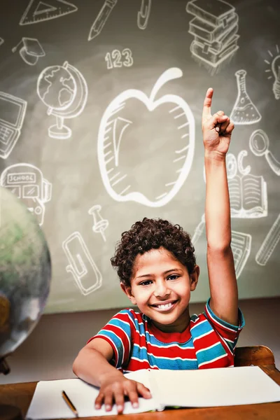 Boy raising hand in classroom — Stock Photo, Image