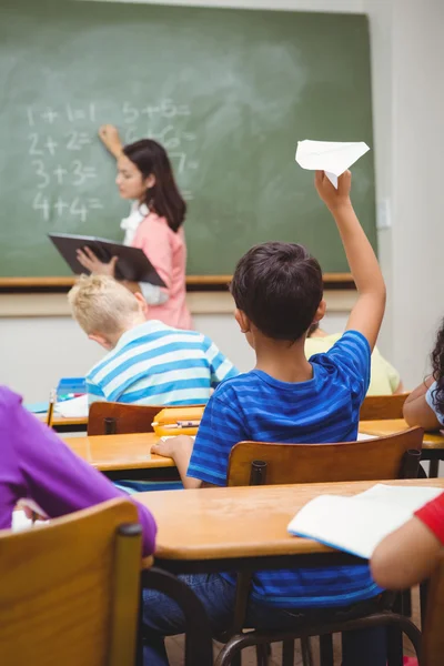 Student about to throw a paper airplane — Stock Photo, Image