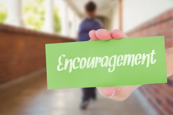 Encouragement against pretty teacher helping pupils in classroom — Stock Photo, Image