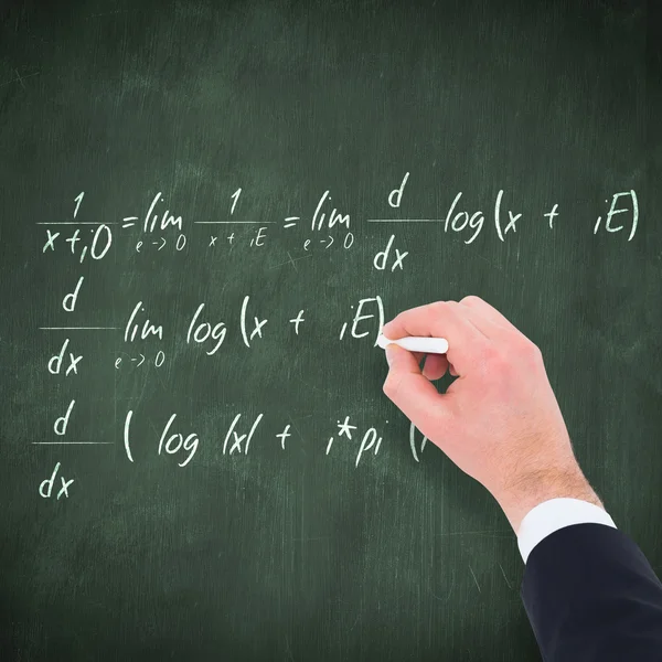 Hand of businessman writing with a white chalk — Stock Photo, Image