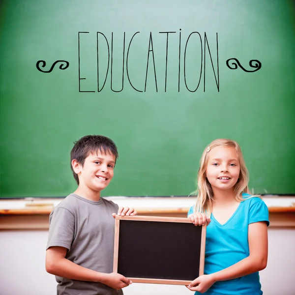 Word education against cute pupils — Stock Photo, Image