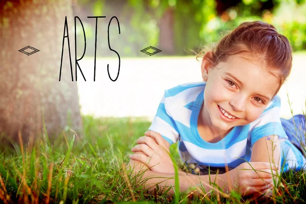 Arts against cute little girl smiling at camera — Stock Photo, Image